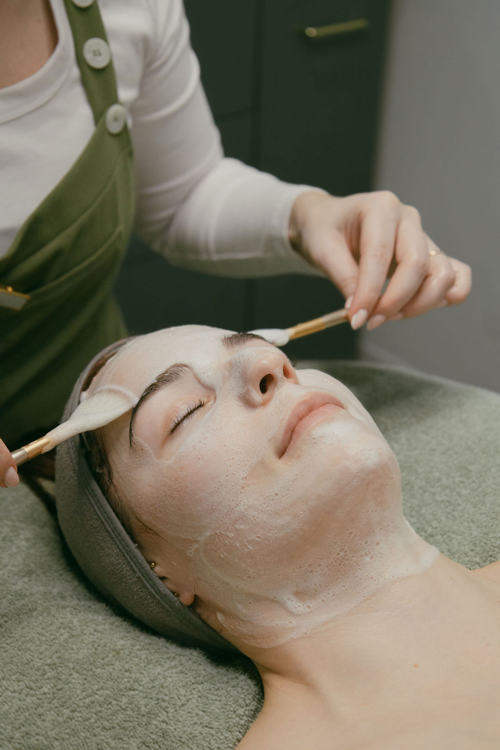 A calm portrait of a woman with healthy, real skin